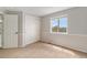Bedroom featuring a closet, carpet, and window allowing natural light at 821 S 34Th Ave, Brighton, CO 80601