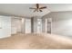 Spacious bedroom with carpet, multiple closets, and doorway access to an attached bathroom at 821 S 34Th Ave, Brighton, CO 80601