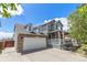 Charming two-story home with a two car garage, covered porch, and landscaped yard at 821 S 34Th Ave, Brighton, CO 80601
