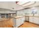 Open kitchen with central island, stainless appliances, and view of living area at 821 S 34Th Ave, Brighton, CO 80601