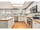 Bright kitchen with stainless steel appliances and white cabinetry at 821 S 34Th Ave, Brighton, CO 80601