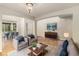 Bright living room with hardwood floors, two armchairs, recessed lights, dining area and modern decor at 821 S 34Th Ave, Brighton, CO 80601