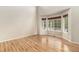 Bright living room with hardwood floors and a bay window at 821 S 34Th Ave, Brighton, CO 80601
