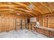View of the shed interior with wooden walls and ceiling, shelving, and a work bench at 821 S 34Th Ave, Brighton, CO 80601