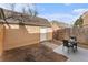 Backyard featuring a patio area, a small lawn, and a storage shed at 2891 S Vaughn Way, Aurora, CO 80014