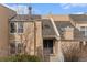 Charming townhouse featuring a covered front entry and well-maintained landscaping at 2891 S Vaughn Way, Aurora, CO 80014