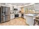 Bright kitchen with stainless steel appliances, tile backsplash, and countertops at 2891 S Vaughn Way, Aurora, CO 80014
