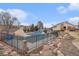 Community pool with fence and rock landscaping features a covered pool for year-round enjoyment at 2891 S Vaughn Way, Aurora, CO 80014
