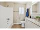 Clean bathroom features a shower and tub combination, tile flooring, window, and vanity with sink at 12702 Fairfax St, Thornton, CO 80241