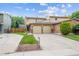 Charming two-story home with a two car garage, brick accents, and a well maintained front yard at 12702 Fairfax St, Thornton, CO 80241