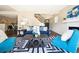 Comfortable living room featuring a staircase, fireplace, and stylish decor at 12702 Fairfax St, Thornton, CO 80241