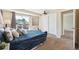 Spacious main bedroom featuring a balcony, a large closet, and elegant decor elements at 12702 Fairfax St, Thornton, CO 80241
