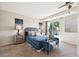 Relaxing main bedroom with a ceiling fan, sliding glass door to a balcony, and stylish furnishings at 12702 Fairfax St, Thornton, CO 80241