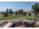 Relaxing backyard deck with comfortable seating and a scenic view at 1143 Belgian Trl, Elizabeth, CO 80107