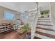 Basement featuring hardwood floors, a playroom, and a staircase that leads to the main level at 1143 Belgian Trl, Elizabeth, CO 80107