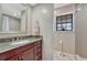Bathroom showcasing granite countertop vanity and decorative glass block window at 1143 Belgian Trl, Elizabeth, CO 80107