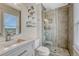 Bathroom featuring stylish gray tile, glass shower, and a modern vanity at 1143 Belgian Trl, Elizabeth, CO 80107