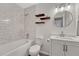 Modern bathroom with white subway tile, floating shelves, and stylish vanity at 1143 Belgian Trl, Elizabeth, CO 80107