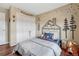 Cozy room featuring mountain headboard, whimsical decor, and spacious closet at 1143 Belgian Trl, Elizabeth, CO 80107