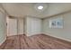 This bedroom includes wood-look floors, window, and ample closet space at 1143 Belgian Trl, Elizabeth, CO 80107