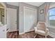 Comfortable bedroom nook with rocker chair, ample closet space, and natural light at 1143 Belgian Trl, Elizabeth, CO 80107