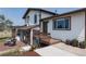 Well-maintained home featuring a cozy porch, green door, and tidy landscaping at 1143 Belgian Trl, Elizabeth, CO 80107