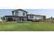 Charming two-story home featuring a sunroom, inviting deck, and well-maintained lawn at 1143 Belgian Trl, Elizabeth, CO 80107