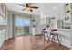 Bright kitchen with white cabinets, stainless steel appliances, and a view to the outdoors at 1143 Belgian Trl, Elizabeth, CO 80107