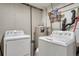 The laundry room has a washer, dryer, and water heater at 1143 Belgian Trl, Elizabeth, CO 80107