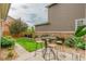 Inviting backyard featuring a patio with a high-top table set and a well-maintained lawn at 540 E Fremont Pl, Centennial, CO 80122