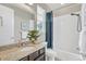 Well-lit bathroom featuring a vanity with granite countertops and a shower-tub combination at 540 E Fremont Pl, Centennial, CO 80122