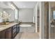 Stylish bathroom featuring granite countertops, a soaking tub, and a walk-in shower at 540 E Fremont Pl, Centennial, CO 80122