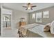 Comfortable bedroom featuring plush bedding, natural light, and a ceiling fan at 540 E Fremont Pl, Centennial, CO 80122
