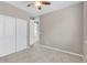 Carpeted bedroom featuring a ceiling fan, closet, and a window at 540 E Fremont Pl, Centennial, CO 80122