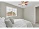 Bright bedroom featuring a cozy bed, large window, and soothing ambiance at 540 E Fremont Pl, Centennial, CO 80122