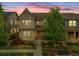 Charming two-story home featuring a covered porch, lush landscaping, and a welcoming facade at 540 E Fremont Pl, Centennial, CO 80122