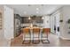 Modern kitchen featuring stainless steel appliances, granite countertops, and a stylish island with seating at 540 E Fremont Pl, Centennial, CO 80122
