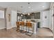 Modern kitchen featuring granite countertops, stainless steel appliances, and stylish bar stool seating at 540 E Fremont Pl, Centennial, CO 80122