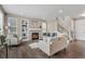 Cozy living room with a fireplace, built-in shelves, and modern decor with an open staircase at 540 E Fremont Pl, Centennial, CO 80122