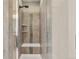Modern shower with tiled walls, built-in shelves, and sleek fixtures at 540 E Fremont Pl, Centennial, CO 80122