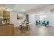 Finished basement with kitchenette, dining area, and cozy seating for relaxation and entertaining at 14247 W 84Th Cir # A, Arvada, CO 80005
