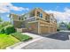 Attractive townhome boasts attached garages, multiple balconies and well-kept lawn at 14247 W 84Th Cir # A, Arvada, CO 80005