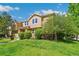 Beautiful townhouse with manicured lawn and lush landscaping at 14247 W 84Th Cir # A, Arvada, CO 80005
