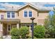 Inviting townhome featuring a charming facade and well-maintained landscaping at 14247 W 84Th Cir # A, Arvada, CO 80005