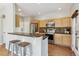 Modern kitchen with stainless steel appliances, ample counter space, and a convenient breakfast bar at 14247 W 84Th Cir # A, Arvada, CO 80005