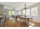 Bright living space with open concept kitchen, dining, and living room featuring many windows at 14247 W 84Th Cir # A, Arvada, CO 80005