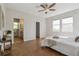 Spacious main bedroom with ample natural light and access to the ensuite bathroom at 14247 W 84Th Cir # A, Arvada, CO 80005