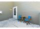 Outdoor patio with seating near the door at 14247 W 84Th Cir # A, Arvada, CO 80005