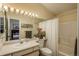 Bathroom with a shower and tub combination and an adjoining bedroom for functionality at 3096 W Prentice Ave # G, Littleton, CO 80123