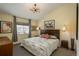 Charming bedroom with neutral tones, stylish lighting, and artistic decor to create a cozy atmosphere at 3096 W Prentice Ave # G, Littleton, CO 80123